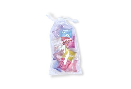 Transparent bag with different scent extractions also wrapped up in a transparent film. The fragrance bags have different colours.