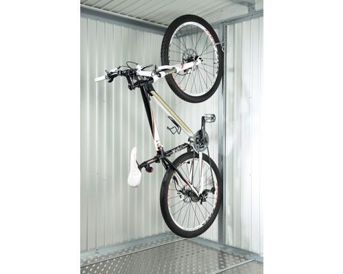 A dark bicycle hung up on the wall of a metal garden shed. Biohort Bicycle Suspension Softub Switzerland