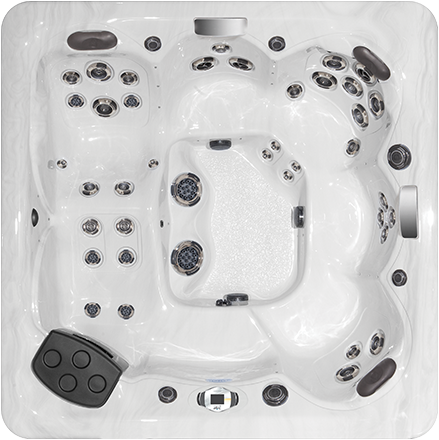 Perspective from above of a big hot tub with different seating arrangements in a white tub.