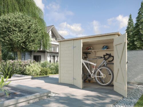 A big box standing in the driveway of a big house. Inside the box stand two bicycles. The box is made out of light wood.