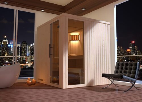 The Weka element sauna made out of spruce. This sauna is pictured in a room that has big windows that shows the city at night in the background. A small light is switched on inside the sauna. The sauna has a front entry with an all glass door. The sauna also has a large all-glass window on the right side for more light.