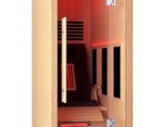Relax Einzelinfrarotkabine Softub Schweiz. Einzelkabine aus hellem Holz mit rotem Licht in der Kabine und einer Liege.