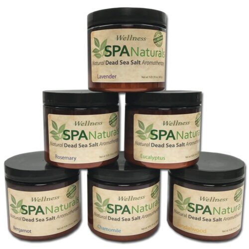 Six different small pots with black lids and beige label, on which is written Spa Naturals in a light and dark green color.