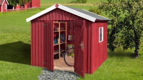 red swedish house with open standing double doors and a white saddle roof.