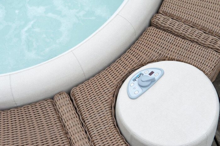 Softub Whirlpool Resort in off-white with motor and brown polyrattan border