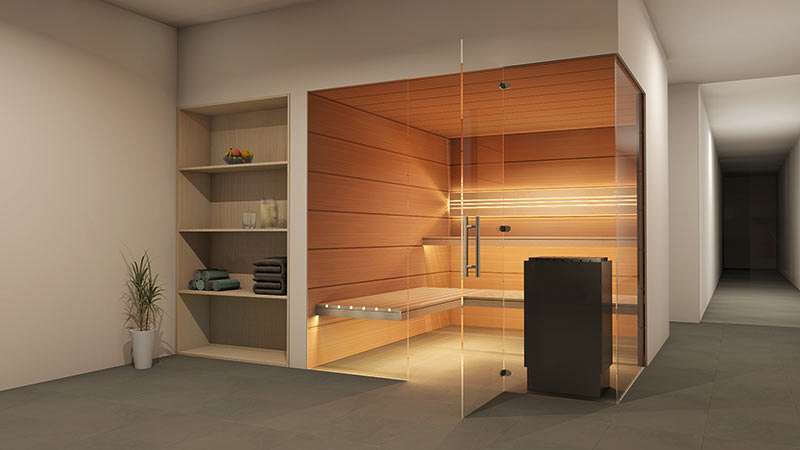 A bright indoor sauna with indirect lighting and floating benches with all-glass front.